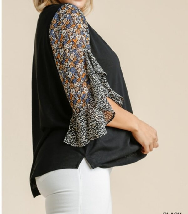 Black top with floral sleeves