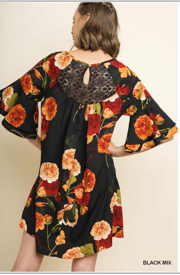 Orange/red flowers on black dress - Image 2